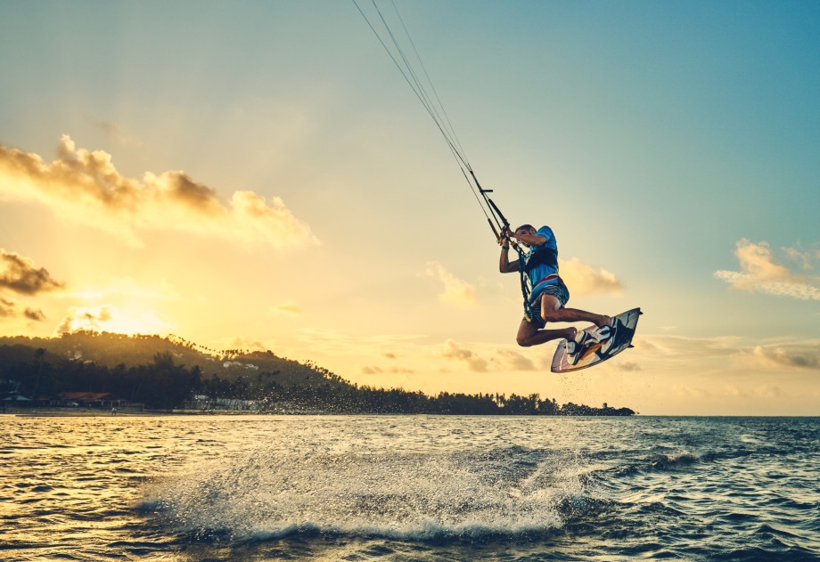 Photo of a man kitesurfing